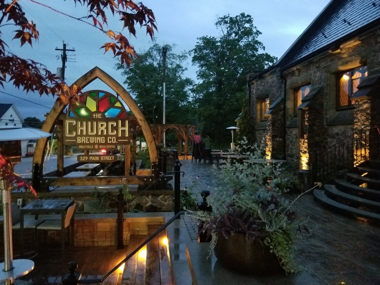 a white plate topped with a salad covered in shrimp