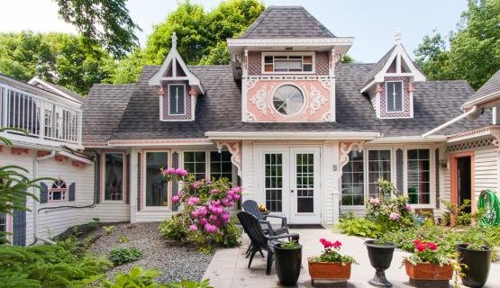 A living room filled with furniture and large windows